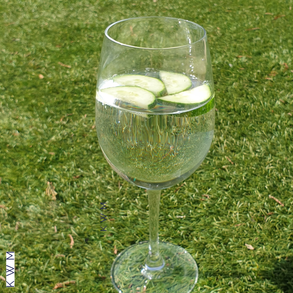 Glass of sparkling water with slices of fresh cucumber for flavour. Boost your immune system with water soluble vitamins and minerals as a way to health.